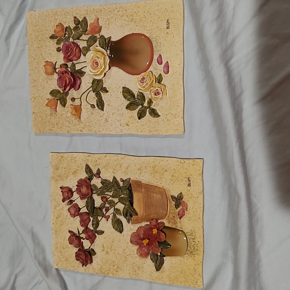 Wall pictures cream mixed with green leaves and red roses, textured background.